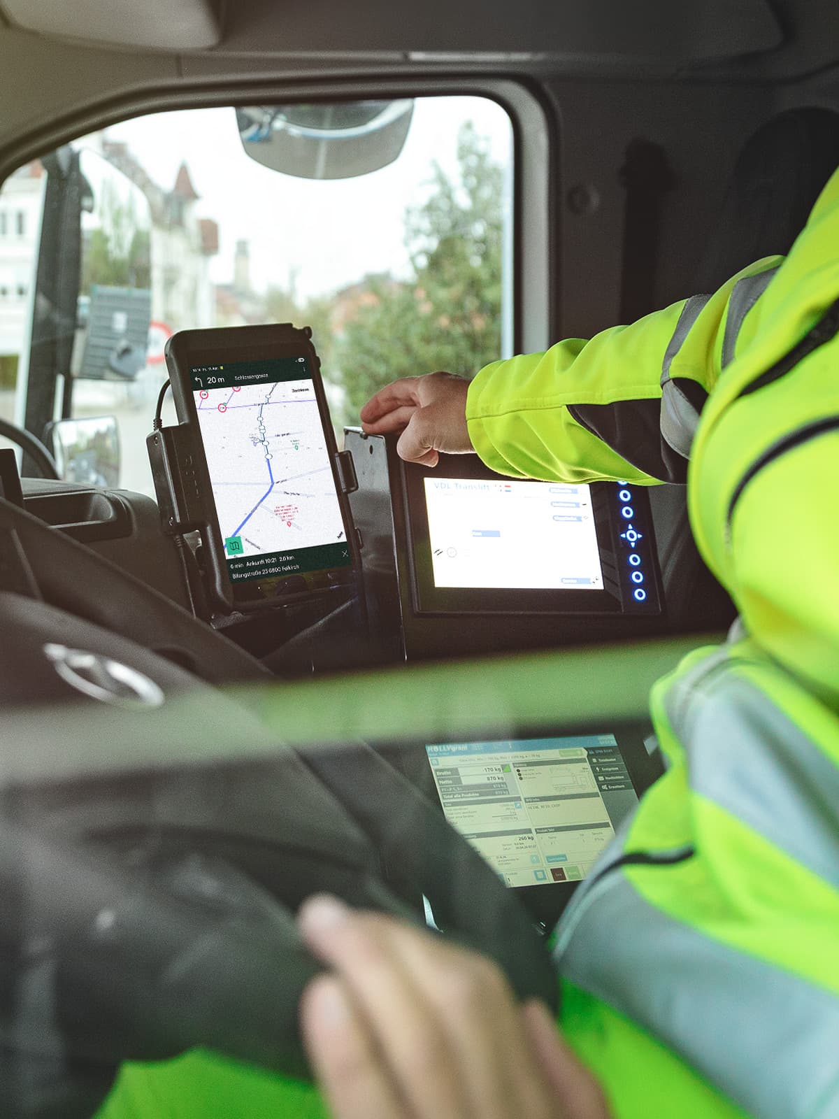 Truck driver views the work route through the app on the tablet.